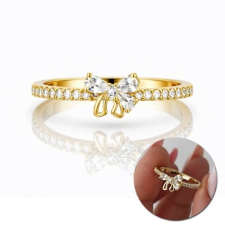 Złoty pierścionek stal chirurgiczna 14k kokarda z cyrkoniami PST994